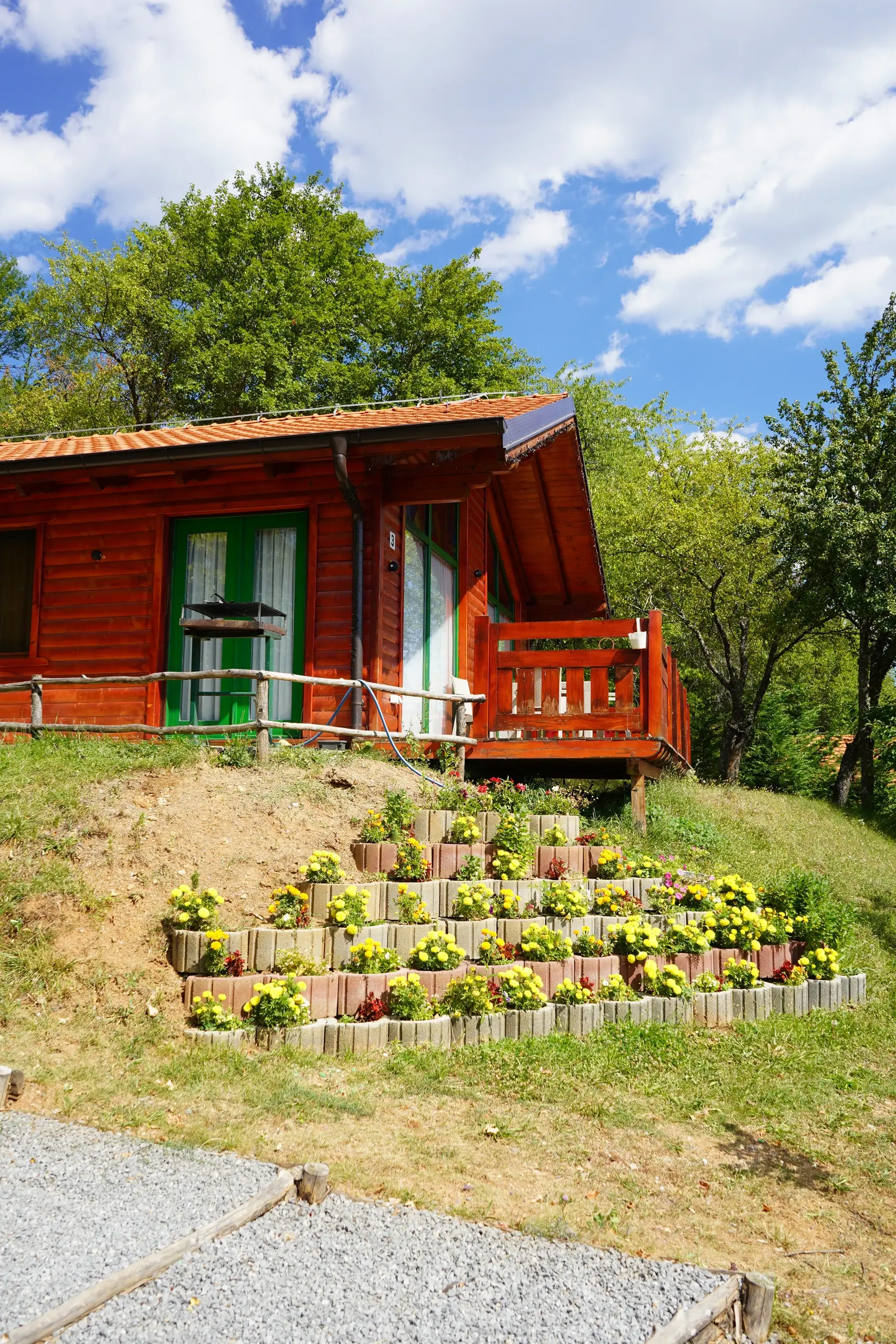 A villa above its terraced flower beds