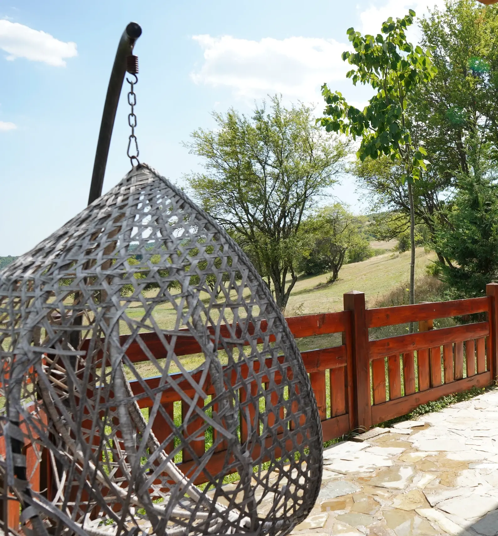 The hanging chair on a villa terrace