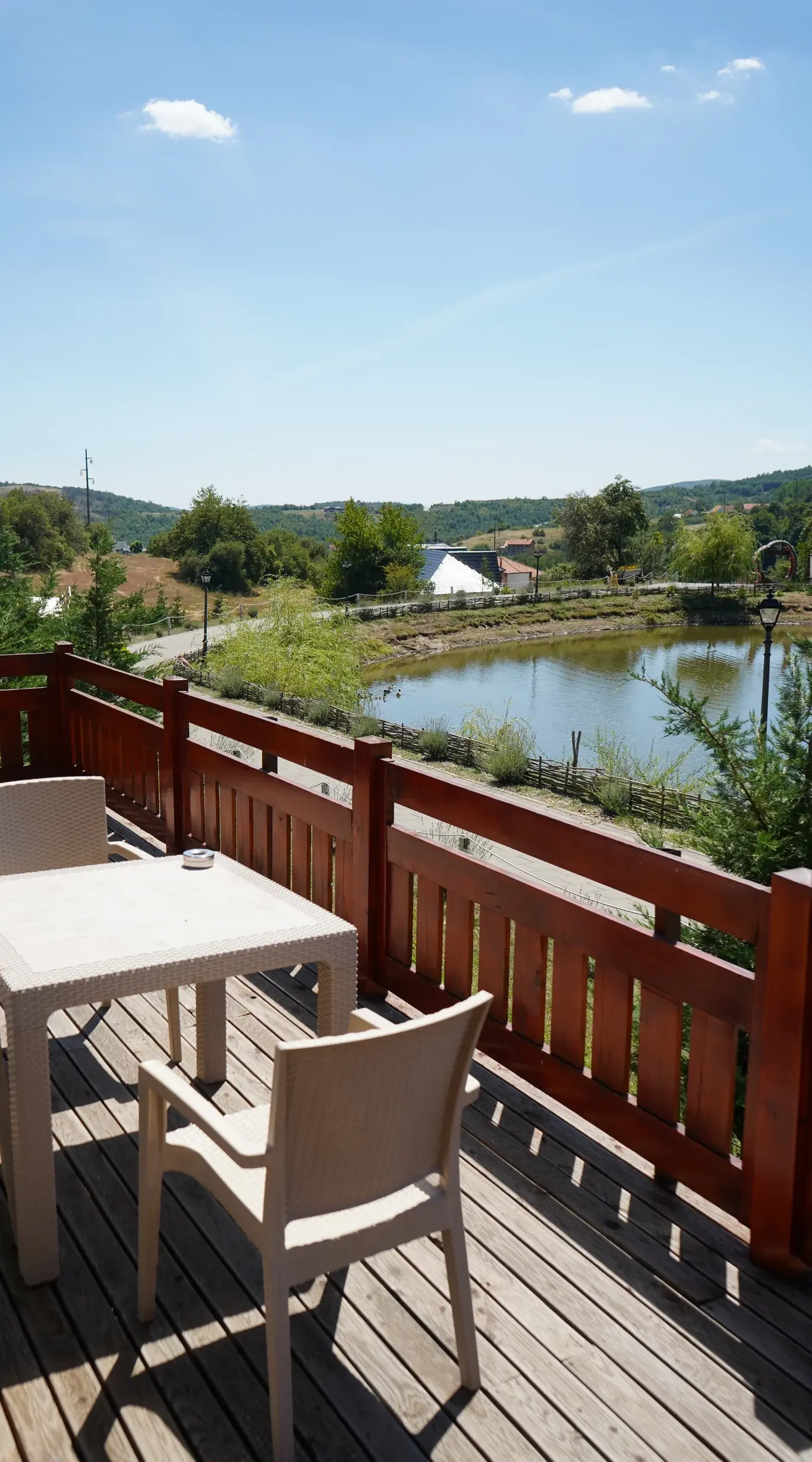 The long table laid on the terrace above the lake
