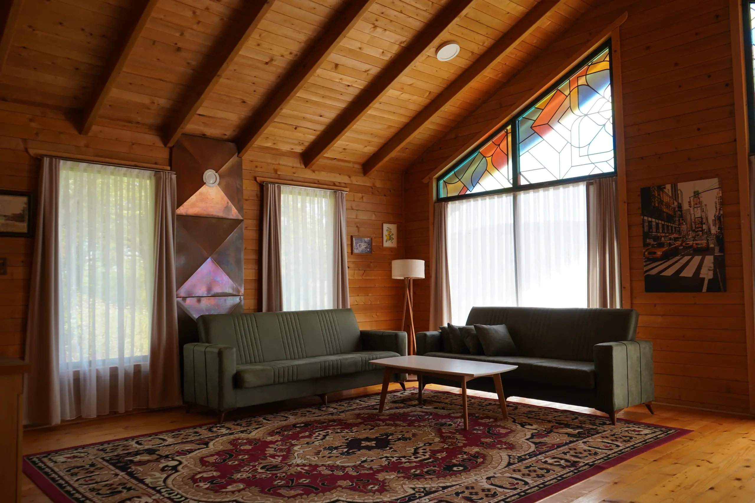 The living room under its stained-glass window